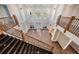 Grand foyer with soaring ceilings, black granite stairs, wrought iron railings, and arched windows at 4710 Troydale Rd, Tampa, FL 33615