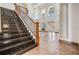 Expansive foyer boasts soaring ceilings, a staircase with iron railings and elegant tile flooring at 4710 Troydale Rd, Tampa, FL 33615