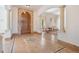 Elegant foyer featuring tile flooring, a decorative center medallion, arched entryways, and a wooden front door at 4710 Troydale Rd, Tampa, FL 33615