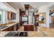 Spacious kitchen featuring a large island, stainless appliances, granite countertops, and custom cabinets at 4710 Troydale Rd, Tampa, FL 33615