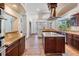 Gourmet kitchen with granite countertops, stainless steel appliances, and custom wood cabinetry at 4710 Troydale Rd, Tampa, FL 33615