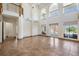Expansive living space with high ceilings, lots of natural light, tile floors, and views of the pool at 4710 Troydale Rd, Tampa, FL 33615