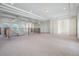 Bright and open loft area with coffered ceilings, carpeted floors, and abundant natural light at 4710 Troydale Rd, Tampa, FL 33615