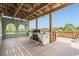 Cabana outdoor kitchen featuring grill, sink, and views of the community at 4710 Troydale Rd, Tampa, FL 33615