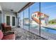 Inviting outdoor pool area with a spa, sun deck, lush greenery, and a screened lanai for relaxed outdoor living at 4710 Troydale Rd, Tampa, FL 33615