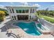 A stunning two-story home with a pristine pool and jacuzzi, perfect for luxurious outdoor living at 4710 Troydale Rd, Tampa, FL 33615