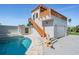 Outdoor entertainment area with a sparkling pool, spa, and unique poolside architecture with a viewing platform at 4710 Troydale Rd, Tampa, FL 33615