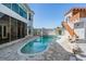 Private pool with a unique cabana structure, lush landscaping, and luxury outdoor living space at 4710 Troydale Rd, Tampa, FL 33615