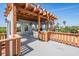 Rooftop terrace with pergola, outdoor kitchen and grill, with views of the trees and neighborhood at 4710 Troydale Rd, Tampa, FL 33615