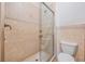 Tiled shower with glass door at 4710 Troydale Rd, Tampa, FL 33615