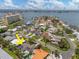 Aerial view of house with pool, solar panels, landscaping, and ocean view at 4739 114Th N St, St Petersburg, FL 33708