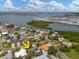 Beautiful aerial shot showcases a cozy home near the waterfront with lush greenery and neighborhood charm at 4739 114Th N St, St Petersburg, FL 33708