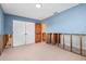 Bedroom with blue walls, features closet doors and a view to another room at 4739 114Th N St, St Petersburg, FL 33708