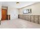 Bright bedroom featuring tile floors, large window, and double door closet, ready to be renovated at 4739 114Th N St, St Petersburg, FL 33708