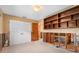 Bright bedroom featuring tile floors, built in shelves, and double door closet, ready to be renovated at 4739 114Th N St, St Petersburg, FL 33708