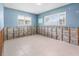 Bedroom with two windows and light blue walls, offering a serene and bright atmosphere at 4739 114Th N St, St Petersburg, FL 33708
