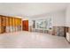 Bright and airy living room featuring tile floors, large windows, and incomplete walls awaiting your dream design at 4739 114Th N St, St Petersburg, FL 33708