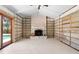 Living room featuring a brick fireplace, tile floors, and sliding door to the outdoors at 4739 114Th N St, St Petersburg, FL 33708