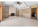 Bright living room featuring tile floors, brick fireplace, and ready to be renovated at 4739 114Th N St, St Petersburg, FL 33708