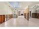 Bright living area with tiled floors, fireplace, and open layout leading to the kitchen, ready for renovation at 4739 114Th N St, St Petersburg, FL 33708