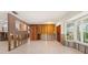 Large living area featuring new tile, an open layout, and expansive windows, ready for personalized renovation at 4739 114Th N St, St Petersburg, FL 33708