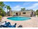 Inviting pool area with brick patio, lounge chairs, and mature landscaping for privacy at 4739 114Th N St, St Petersburg, FL 33708