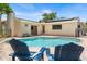 Outdoor living with a refreshing pool and comfortable seating surrounded by lush greenery at 4739 114Th N St, St Petersburg, FL 33708