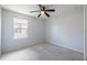 Comfortable bedroom with neutral carpet, a ceiling fan, and a bright window at 4743 Somerset Hill Ln, Riverview, FL 33578