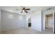 Spacious bedroom featuring neutral carpet, ample natural light, ceiling fan, and ensuite access at 4743 Somerset Hill Ln, Riverview, FL 33578