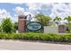 Magnolia Park entrance sign with manicured hedges and palm trees creating an inviting community presence at 4743 Somerset Hill Ln, Riverview, FL 33578
