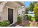 Charming front entrance with a black door and well-maintained landscaping and visible house numbers at 4743 Somerset Hill Ln, Riverview, FL 33578