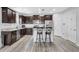 Well-equipped kitchen with stainless steel appliances, granite countertops, and a breakfast bar at 4743 Somerset Hill Ln, Riverview, FL 33578