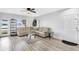 Bright living room with modern flooring and a comfortable leather sofa, perfect for relaxation at 4743 Somerset Hill Ln, Riverview, FL 33578