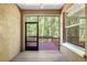 Screened balcony with wooded view from the property at 4920 Anniston Cir, Tampa, FL 33647