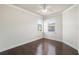 Bright, empty bedroom with hardwood floors, neutral walls, and windows at 4920 Anniston Cir, Tampa, FL 33647