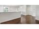 Second floor loft space with hardwood floors, neutral walls, and natural light from window at 4920 Anniston Cir, Tampa, FL 33647