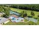 Aerial view of a community playground with tennis courts, a basketball court, and a playset at 4920 Anniston Cir, Tampa, FL 33647