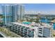 Aerial view of residential buildings with a rooftop pool and expansive views of the surrounding cityscape and waterway at 5120 Marina Way # 15005, Tampa, FL 33611
