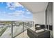 Spacious balcony with tile floor, glass railings, and comfortable patio furniture at 5120 Marina Way # 15005, Tampa, FL 33611