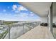 Spacious balcony with tile floor, glass railings, and comfortable patio furniture at 5120 Marina Way # 15005, Tampa, FL 33611