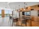 Modern bar area with sleek marble countertop, pendant lighting, and convenient access to water views at 5120 Marina Way # 15005, Tampa, FL 33611