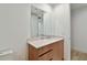 Bathroom vanity with modern wood drawers, stone countertop and large mirror at 5120 Marina Way # 15005, Tampa, FL 33611