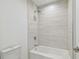 Bright bathroom featuring tiled shower and a modern toilet at 5120 Marina Way # 15005, Tampa, FL 33611