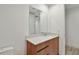 Bathroom vanity with modern wood drawers, stone countertop and large mirror at 5120 Marina Way # 15005, Tampa, FL 33611