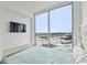 This bedroom features floor-to-ceiling windows with views of the city, and a luxuriously tufted headboard at 5120 Marina Way # 15005, Tampa, FL 33611