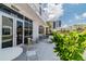 Exterior view of a restaurant featuring tables and chairs with a glimpse of upscale buildings in the background at 5120 Marina Way # 15005, Tampa, FL 33611