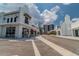 Exterior view of commercial buildings with restaurants and retail, and red umbrellas at 5120 Marina Way # 15005, Tampa, FL 33611