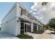 Exterior view of storefront with an awning and large windows in a commercial building at 5120 Marina Way # 15005, Tampa, FL 33611