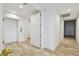 Bright and modern hallway with wood-look tile floors at 5120 Marina Way # 15005, Tampa, FL 33611