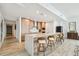 Stylish kitchen featuring a long island with bar seating, wood cabinets, modern appliances, and luxury finishes at 5120 Marina Way # 15005, Tampa, FL 33611